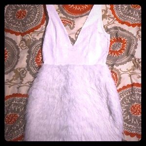White sequin and fur dress. Low cut